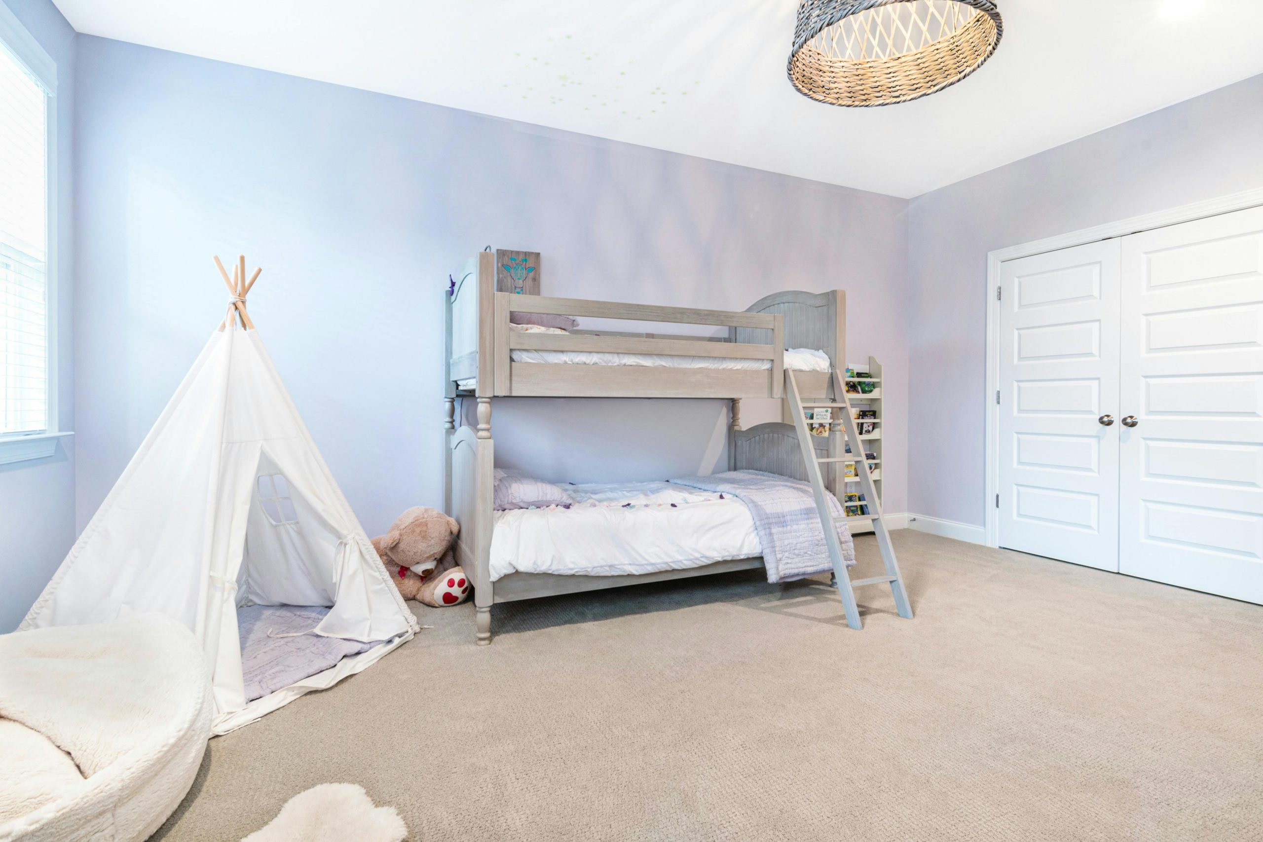 Playful Neutral Kids' Room with Lavender Walls and Bunk Beds