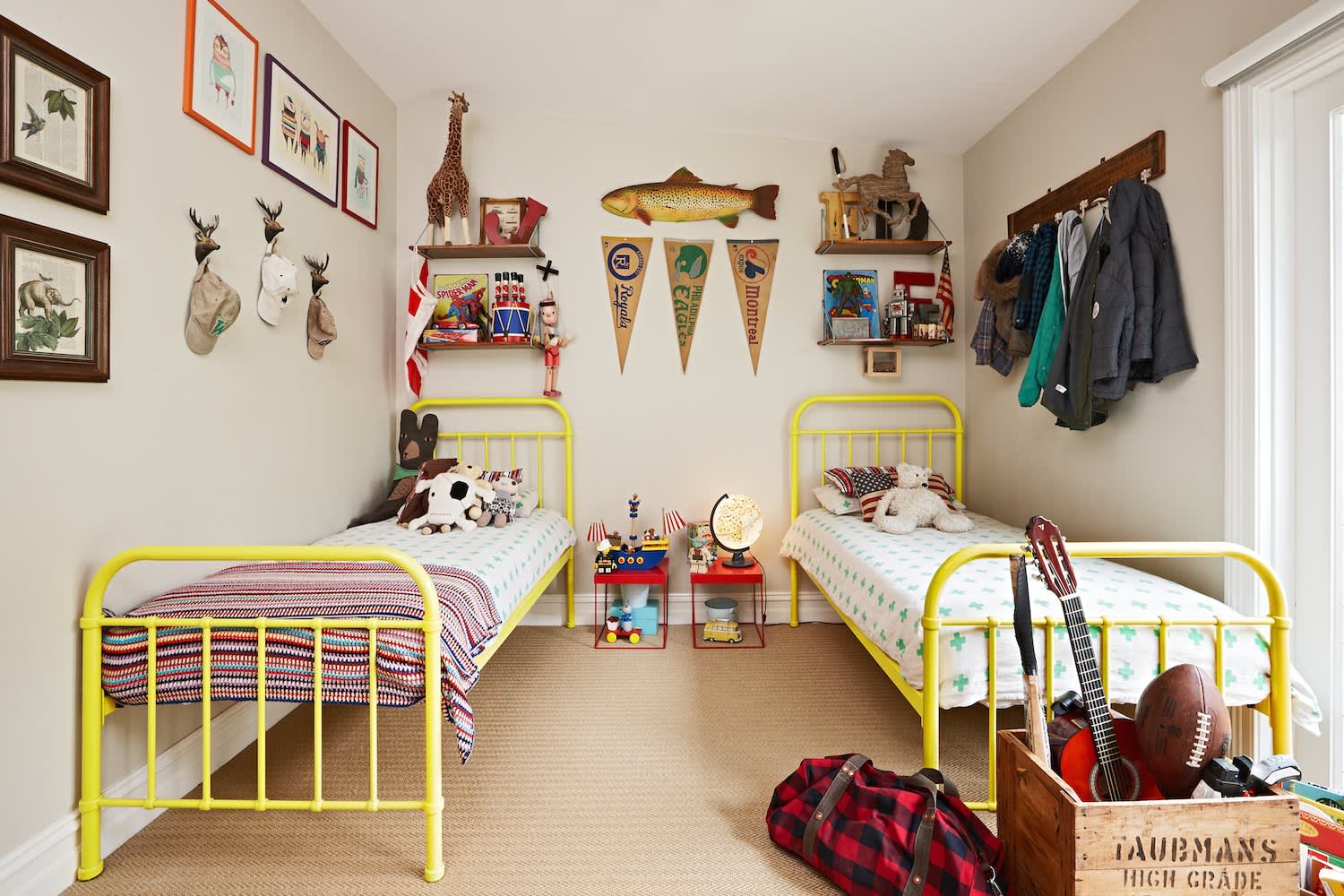 Playful Shared Bedroom with Bright Yellow Beds and Eclectic Decor