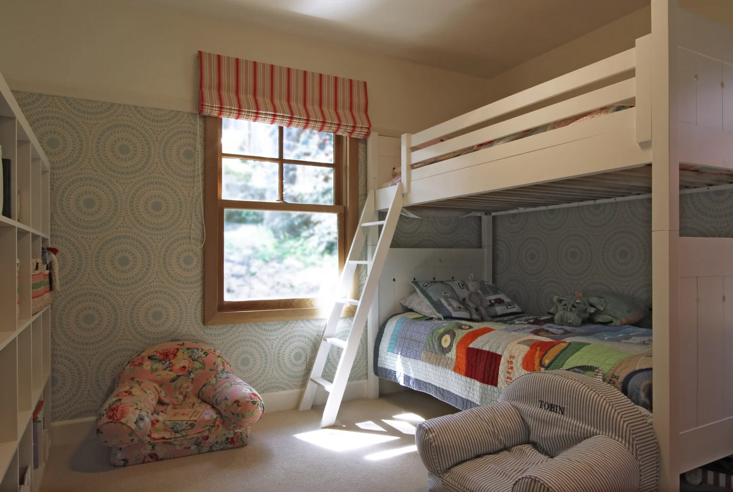 Cozy Kids' Room with Bunk Bed and Patterned Wallpaper