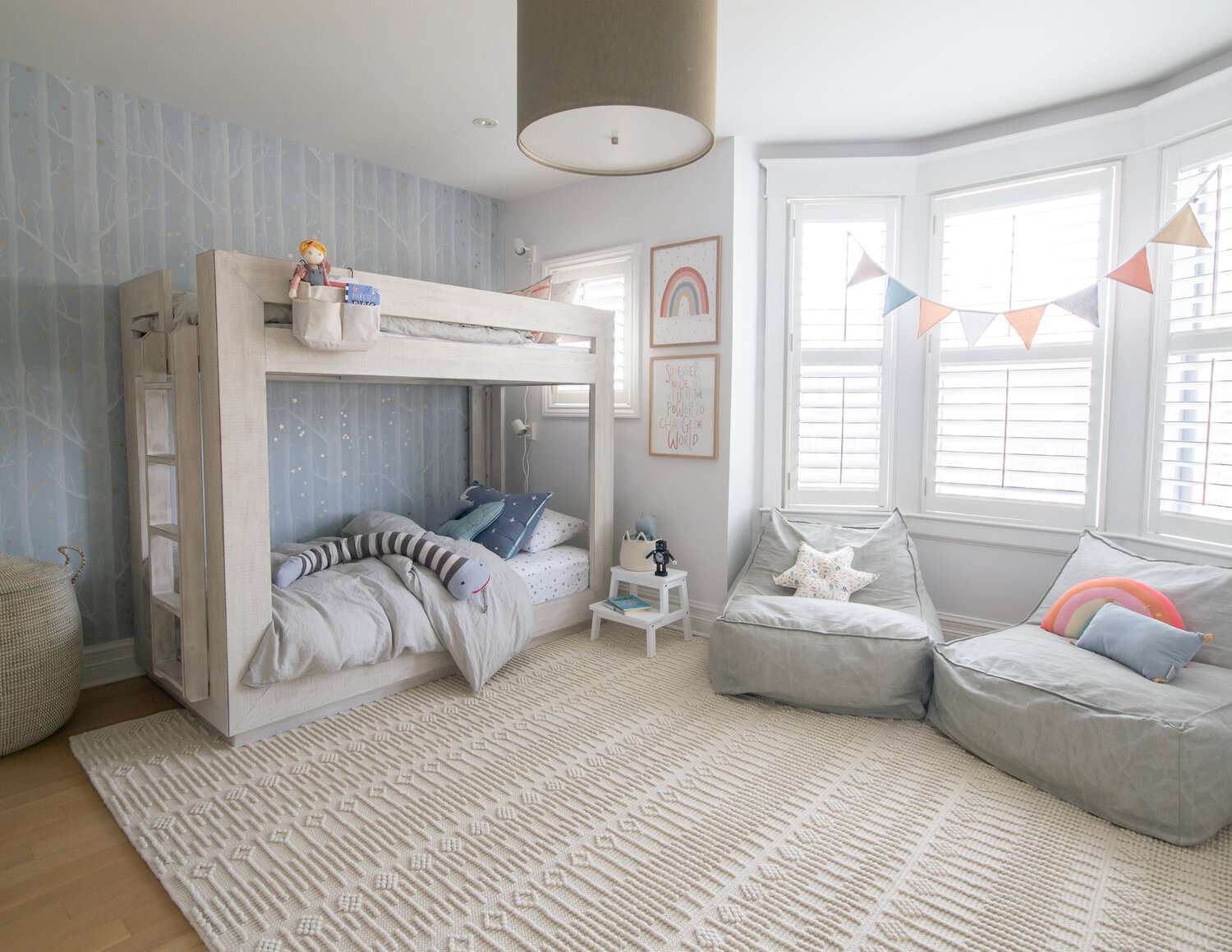 Neutral Kids' Shared Bedroom with Bunk Beds and Bay Window Nook