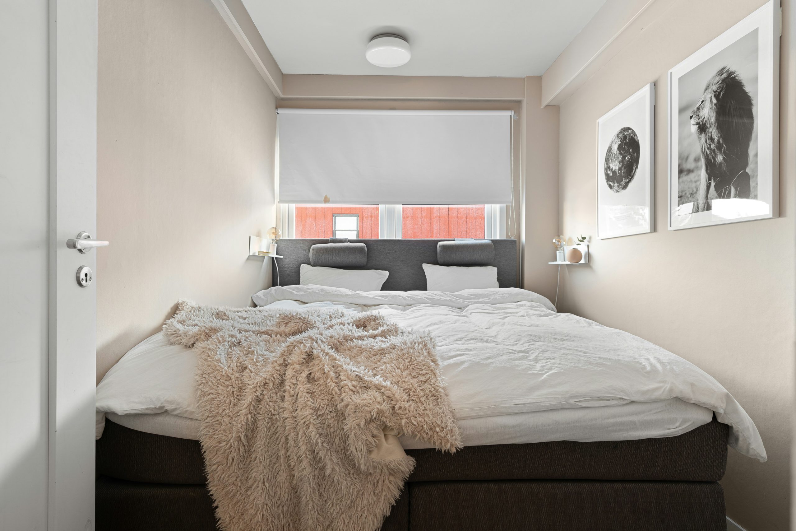 Neutral Small Bedroom with Wall Art and Textured Throw