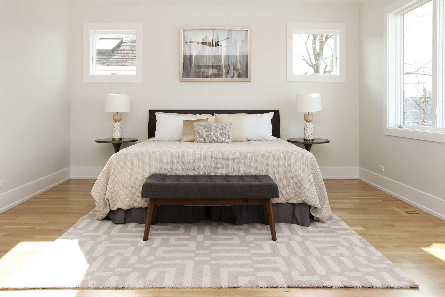 Neutral Minimal Bedroom with Geometric Rug and Subtle Textures