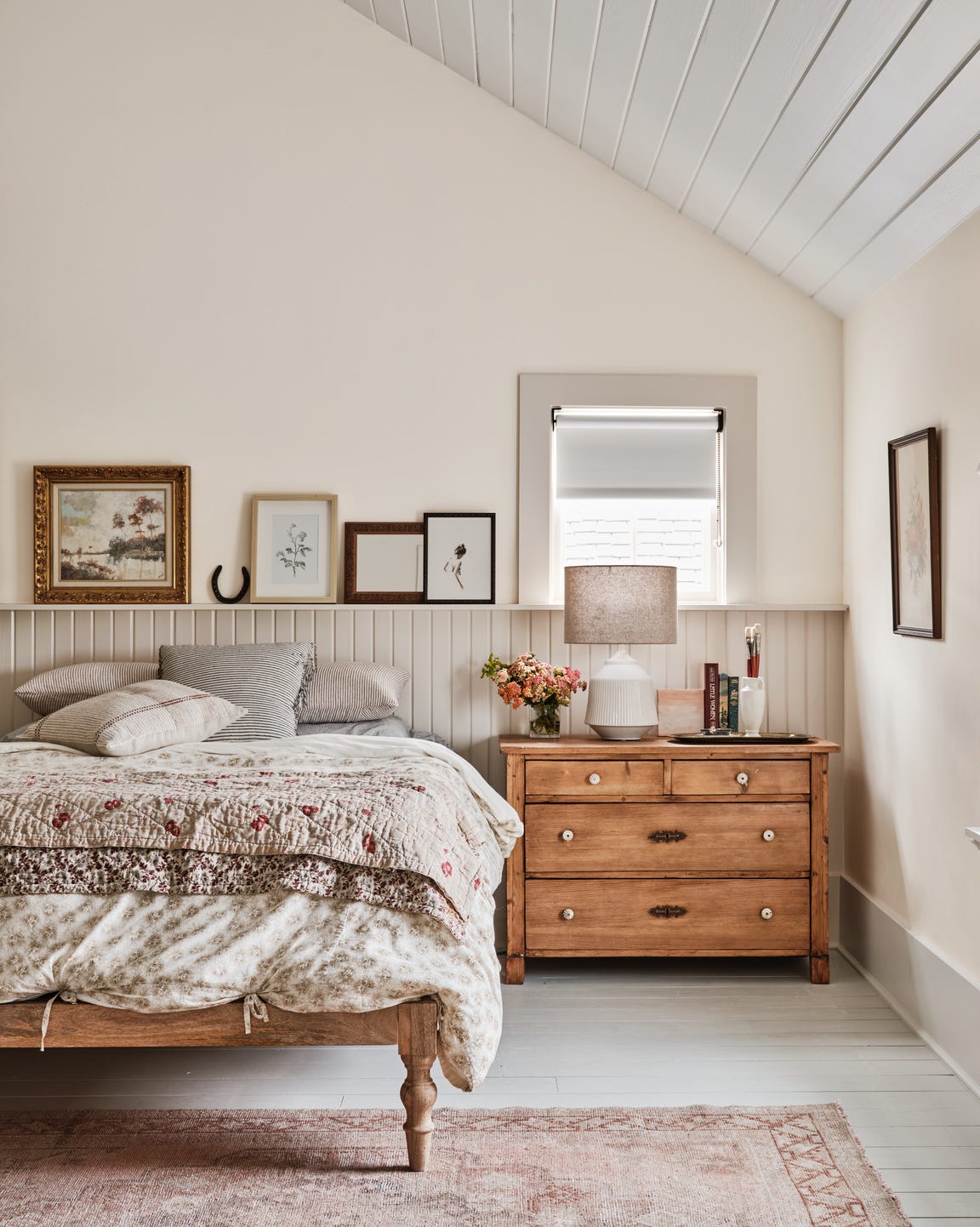 Cozy Farmhouse Bedroom with Whitewashed Wood and Floral Textiles