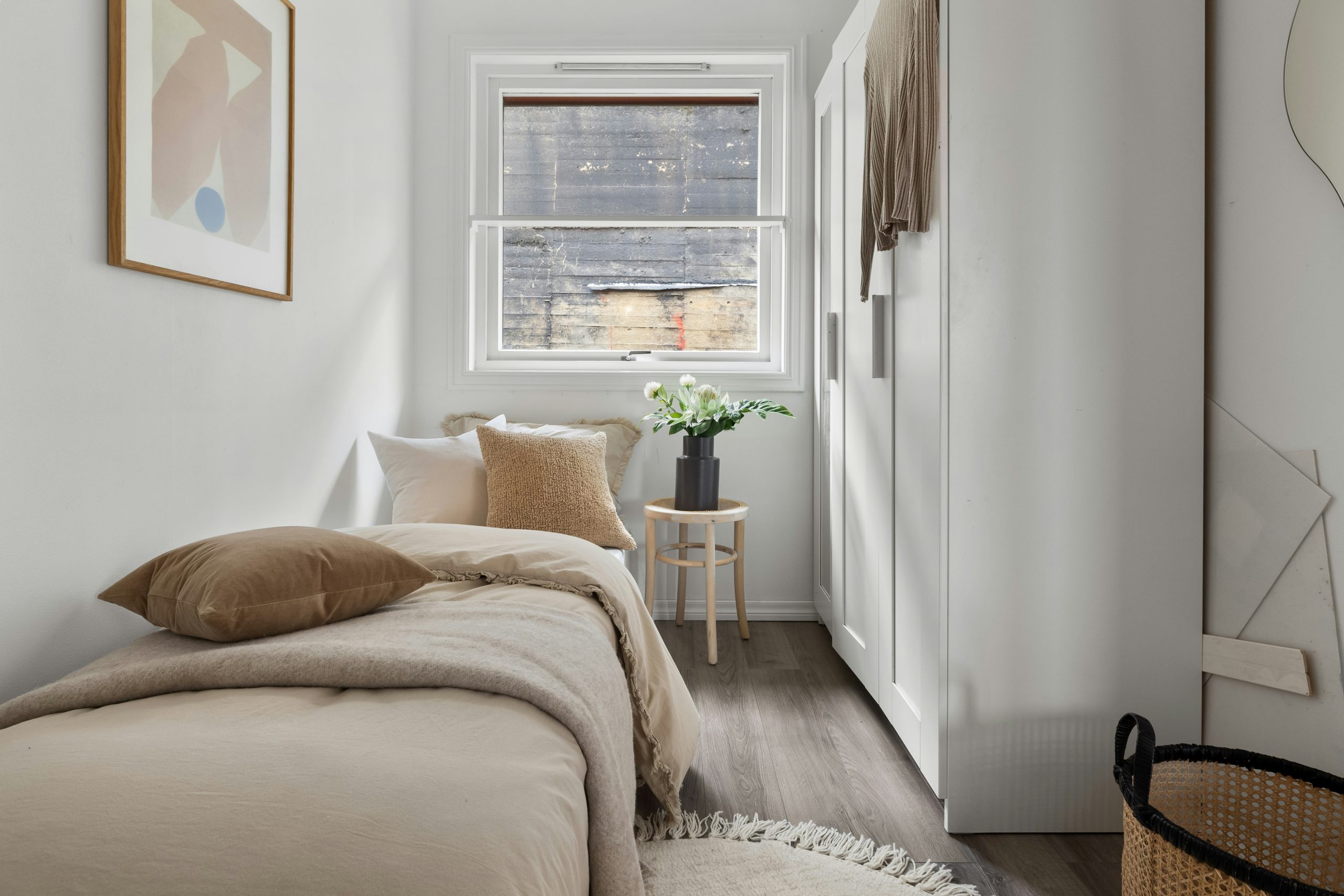 Neutral Small Bedroom with Minimalist Decor and Wood Accents