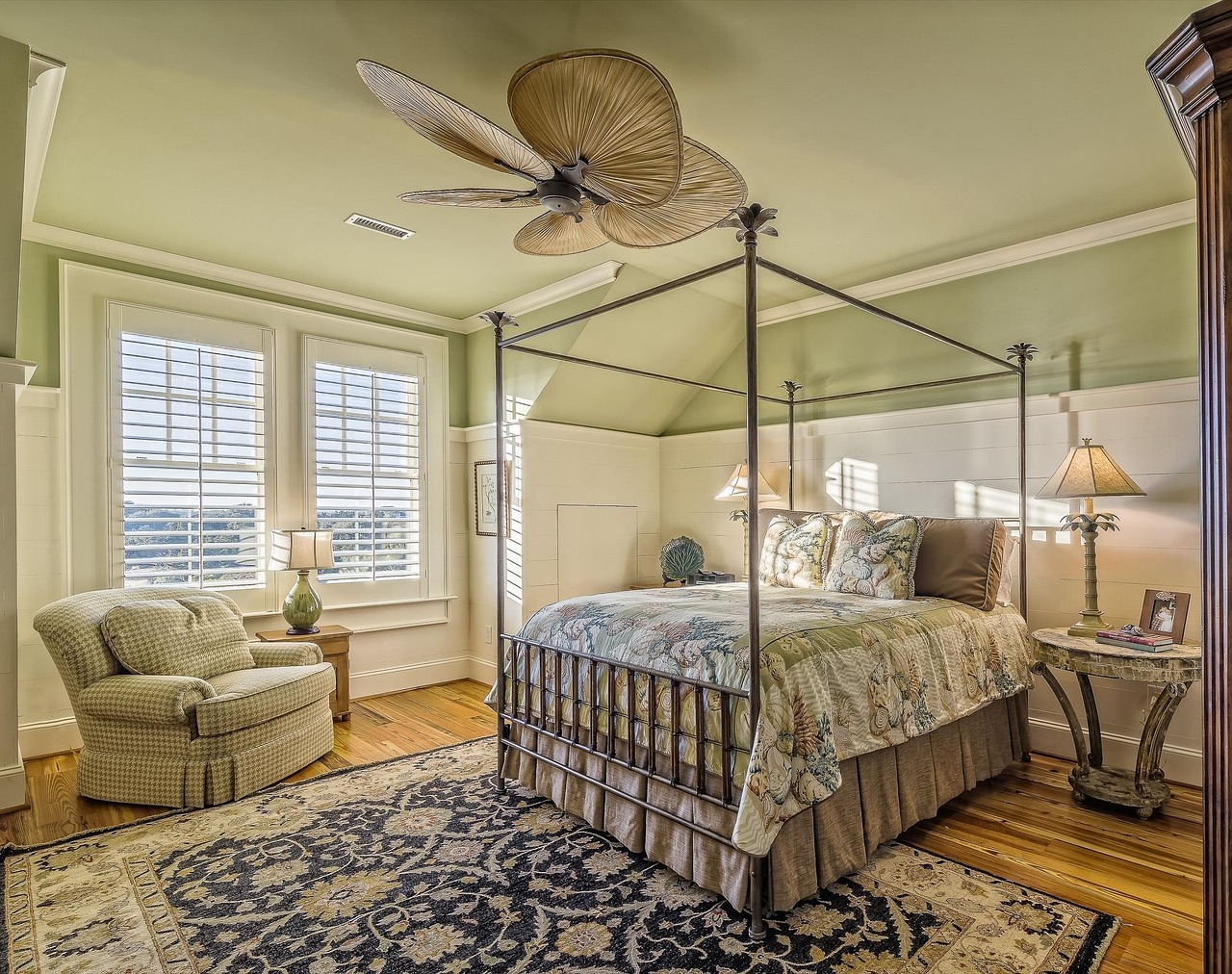 Cozy Bedroom with Curved Headboard and Rattan Nightstands