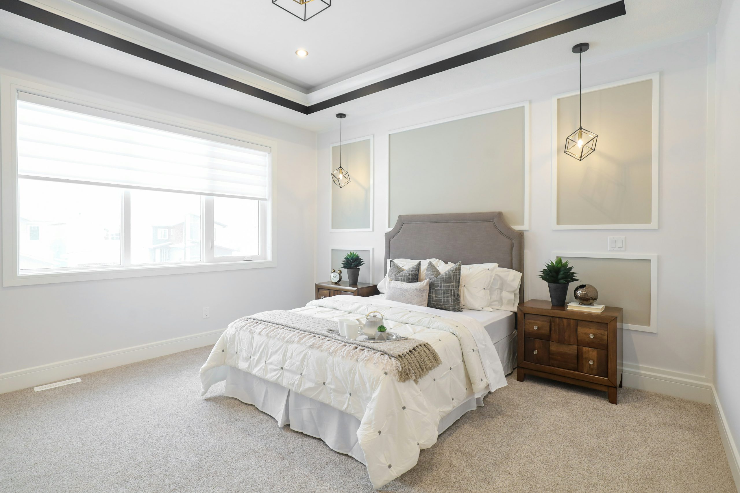 Light Blue Bedroom with Four-Poster Bed and Patterned Accents