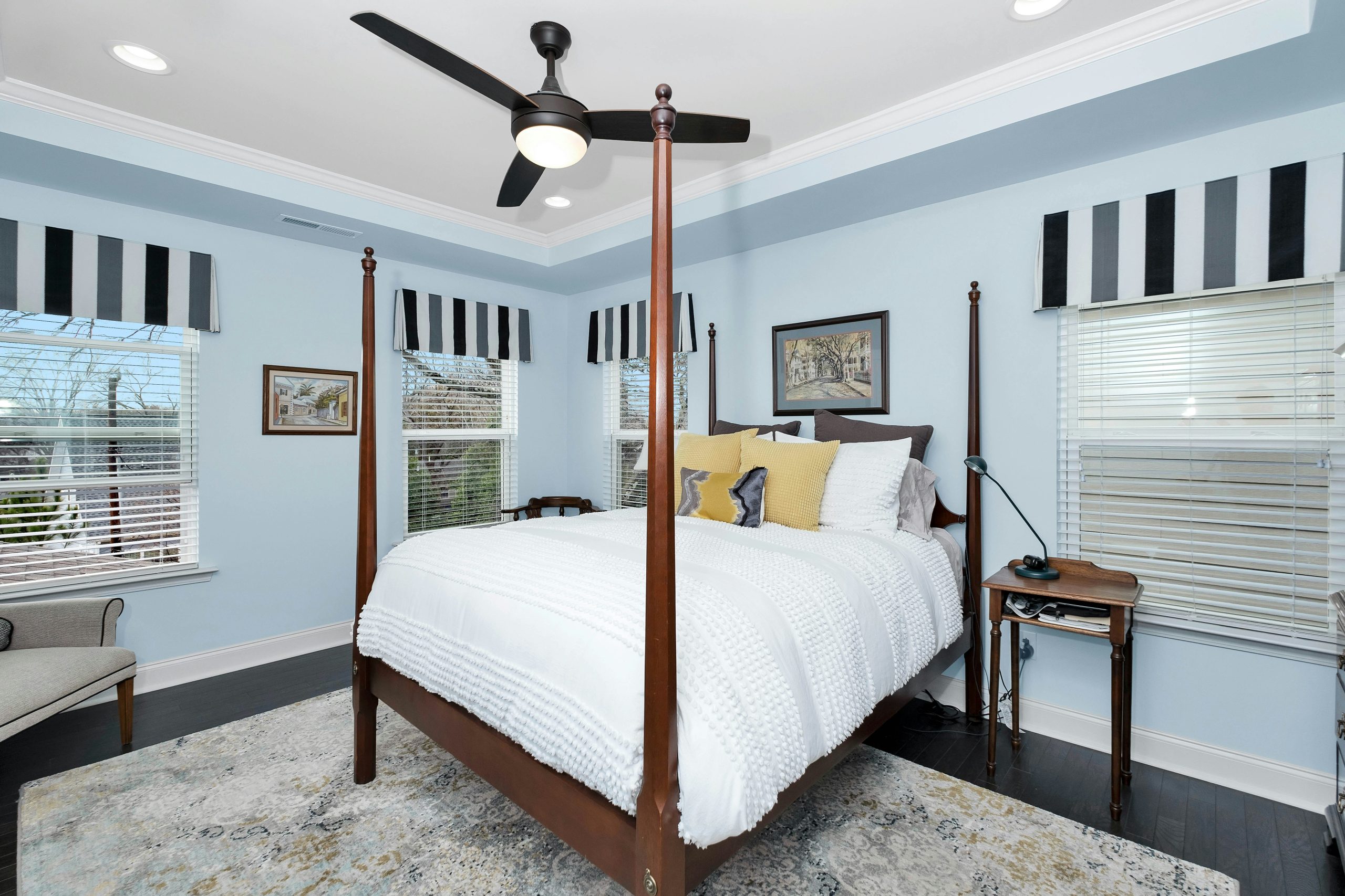 Modern Bedroom with Light Wood, Grey Paneling, and Gold Accents