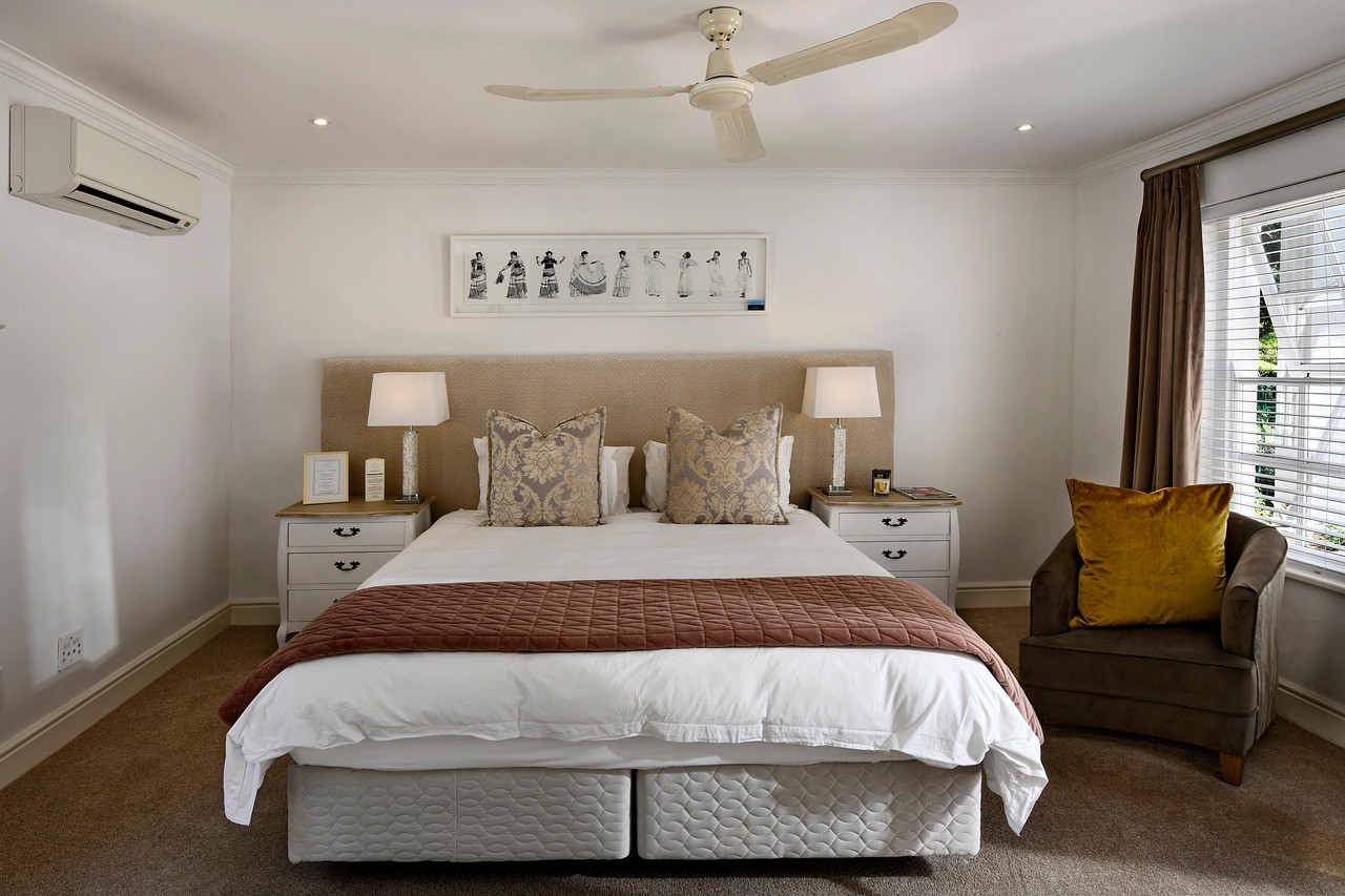 Modern Grey and White Bedroom with Natural Wood Accents and Balcony Access