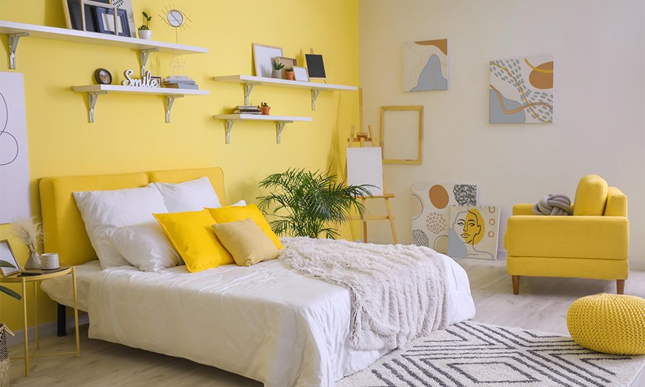 Bright Yellow Bedroom with Eclectic Artwork and Soft Furnishings