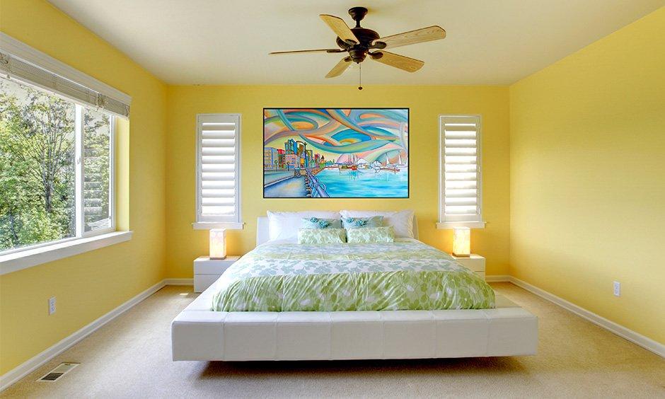 Sunny Yellow Bedroom with Floating White Bed and Cityscape Art