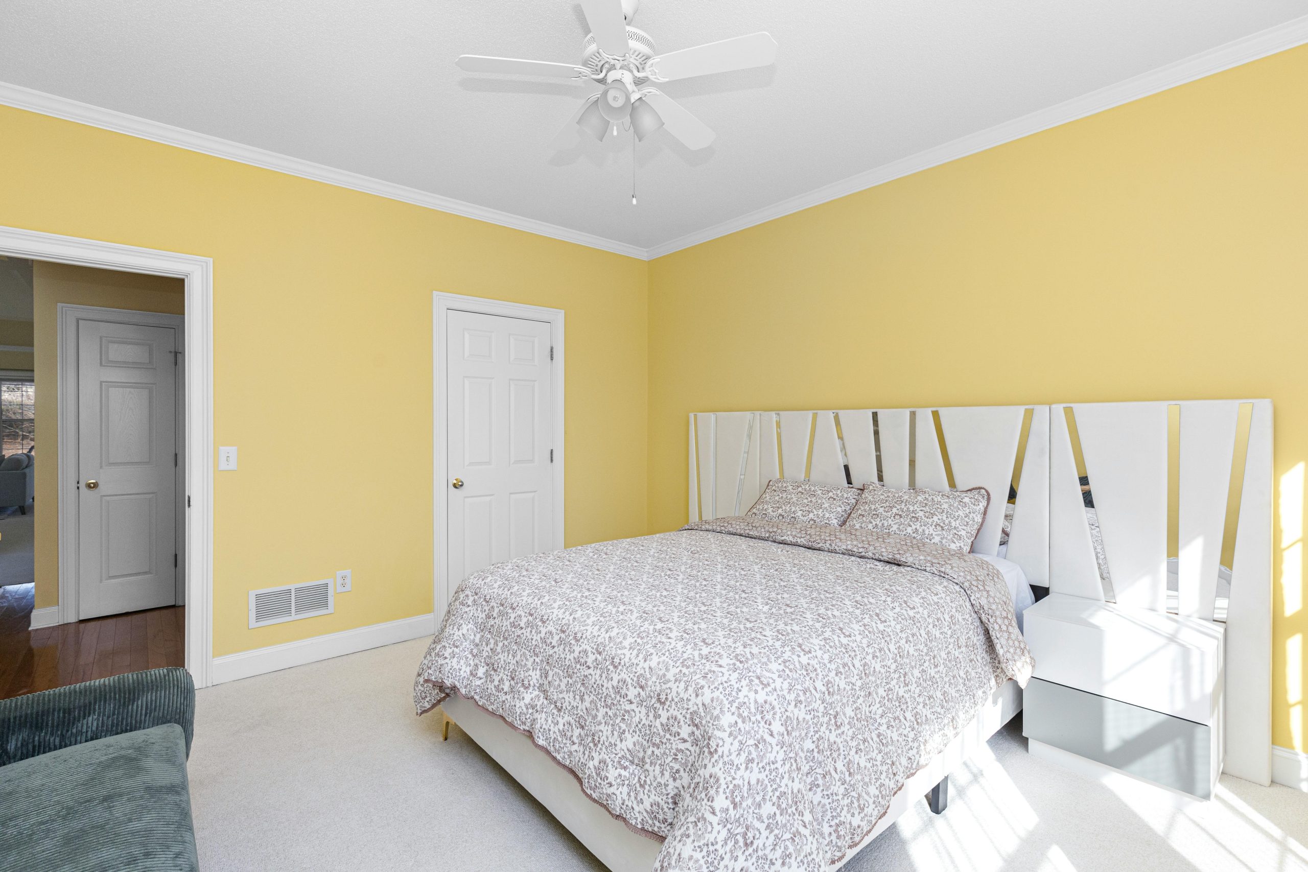 Modern Minimal Yellow Bedroom with Patterned Bedding