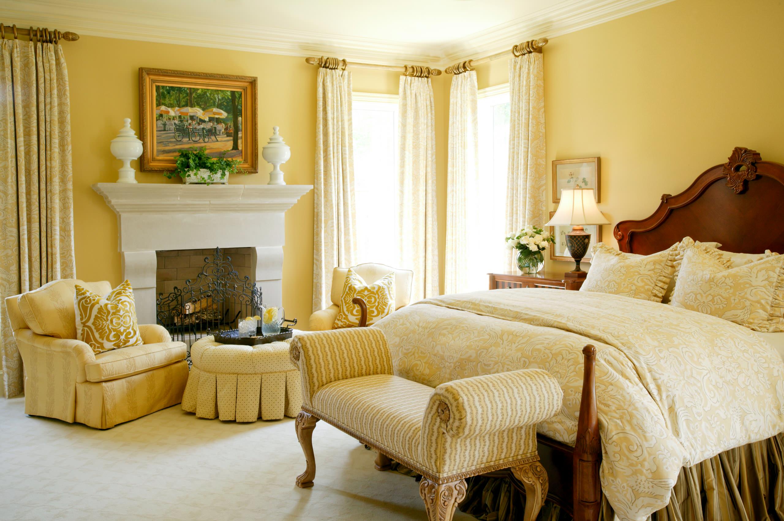 Traditional Bedroom with Warm Yellow Walls and Patterned Textiles