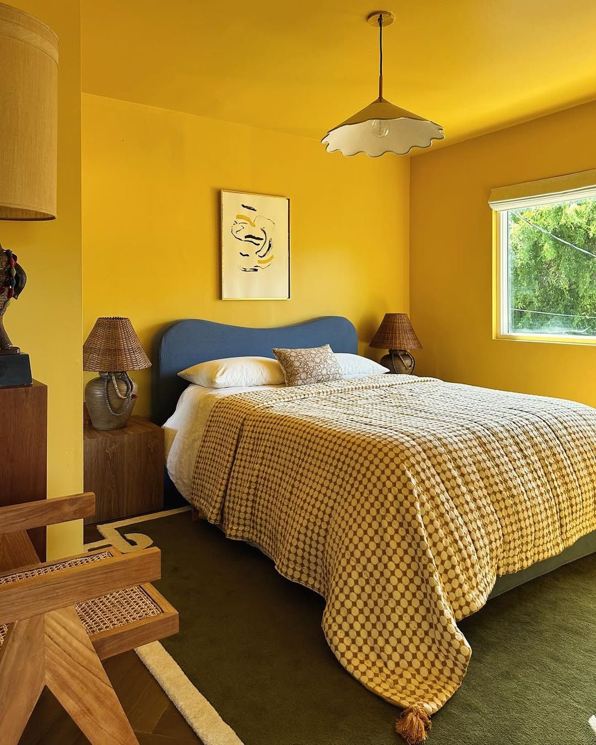 Saffron Yellow Bedroom with Scalloped Lighting and Dark Accents