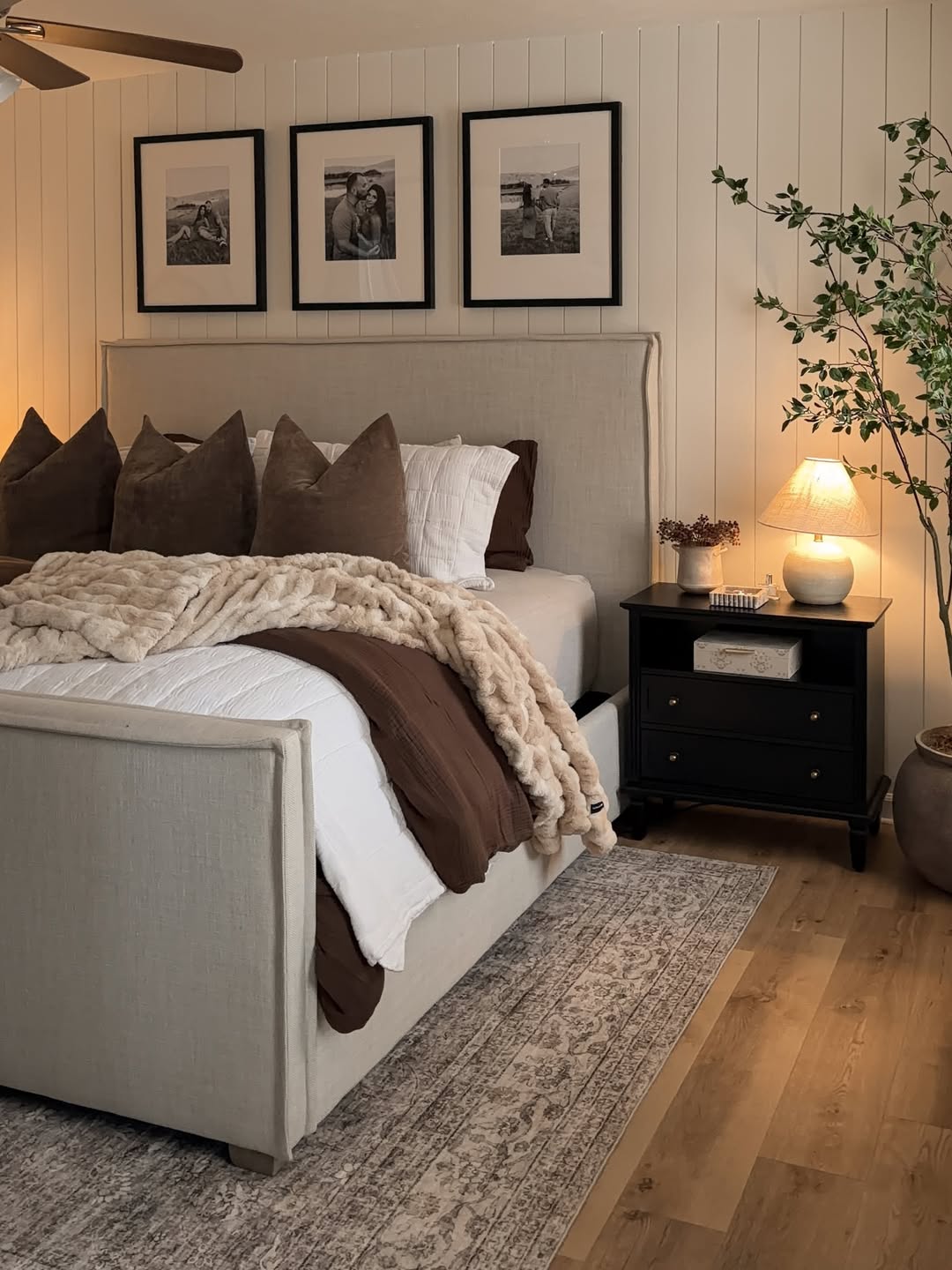 Cozy Bedroom Retreat with Layered Textures and Monochrome Art