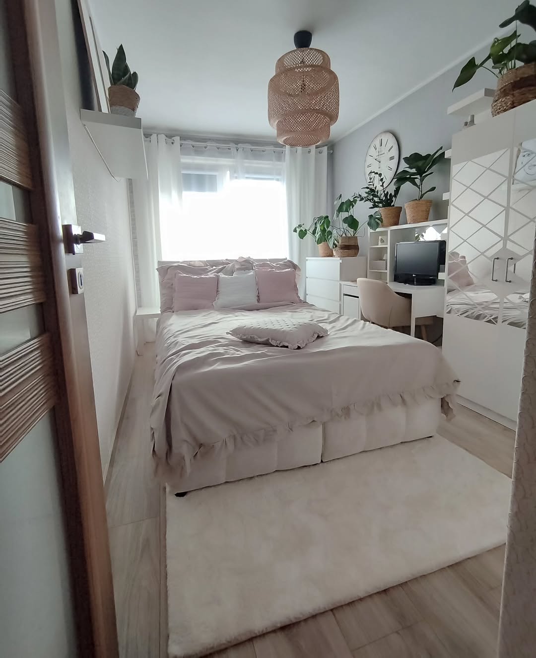 Cozy Bedroom with Ruffled Pale Pink and Natural Wood Accents