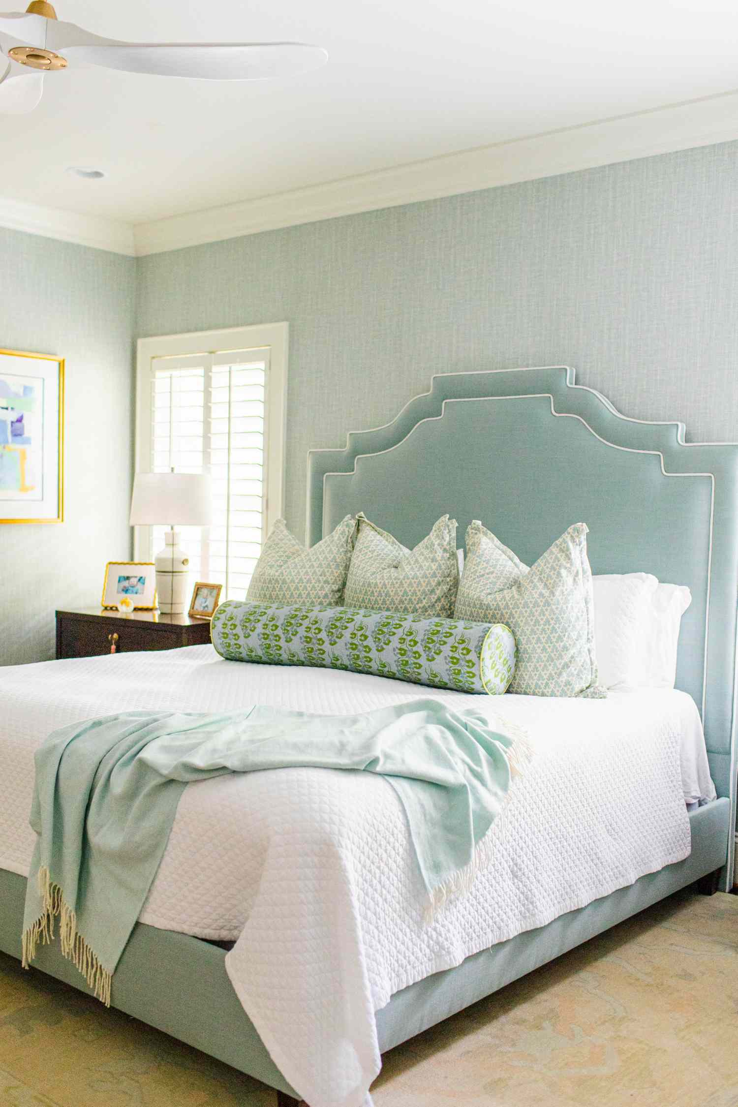 Aqua Upholstered Bed with Pattern and Textured Wallpaper