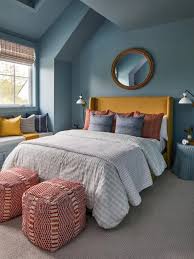 Relaxing Blue Guest Bedroom with Patterned Wallpaper and White Trim