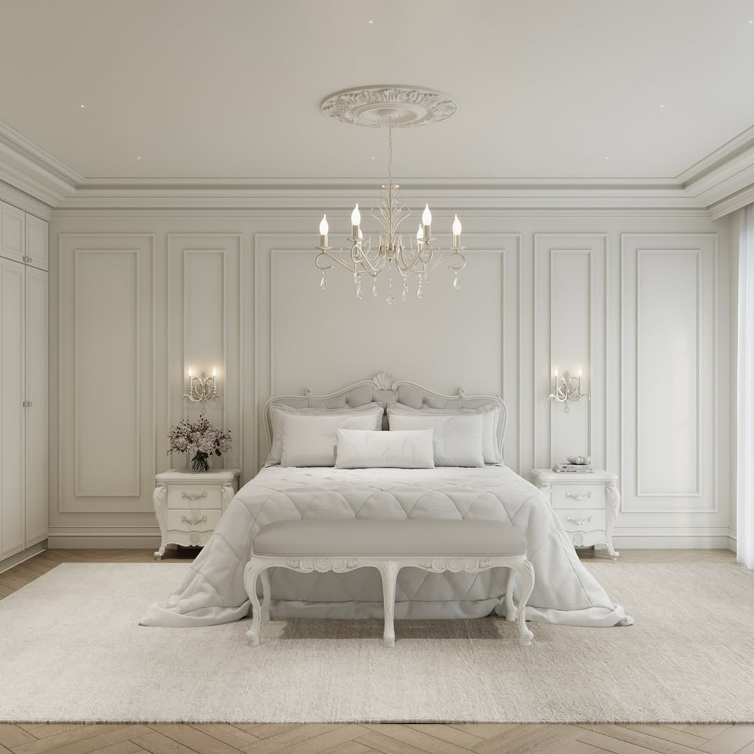Regal White Bedroom with Ornate Trim and Crystal Chandelier
