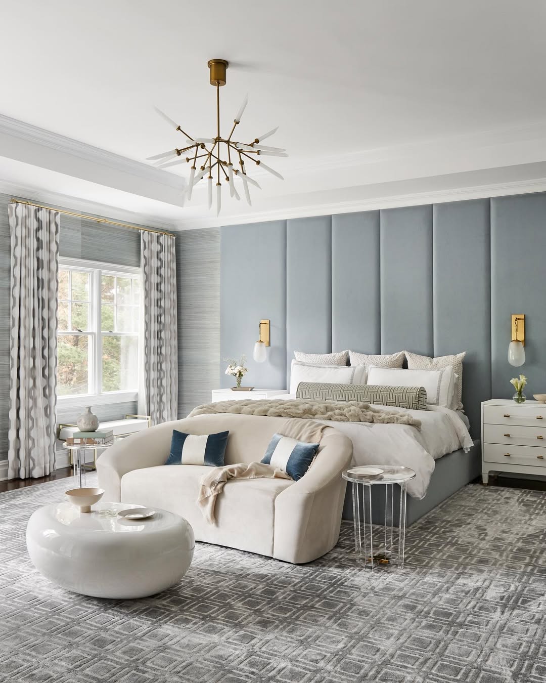 Modern Serene Bedroom with Padded Headboard and Gold Fixtures