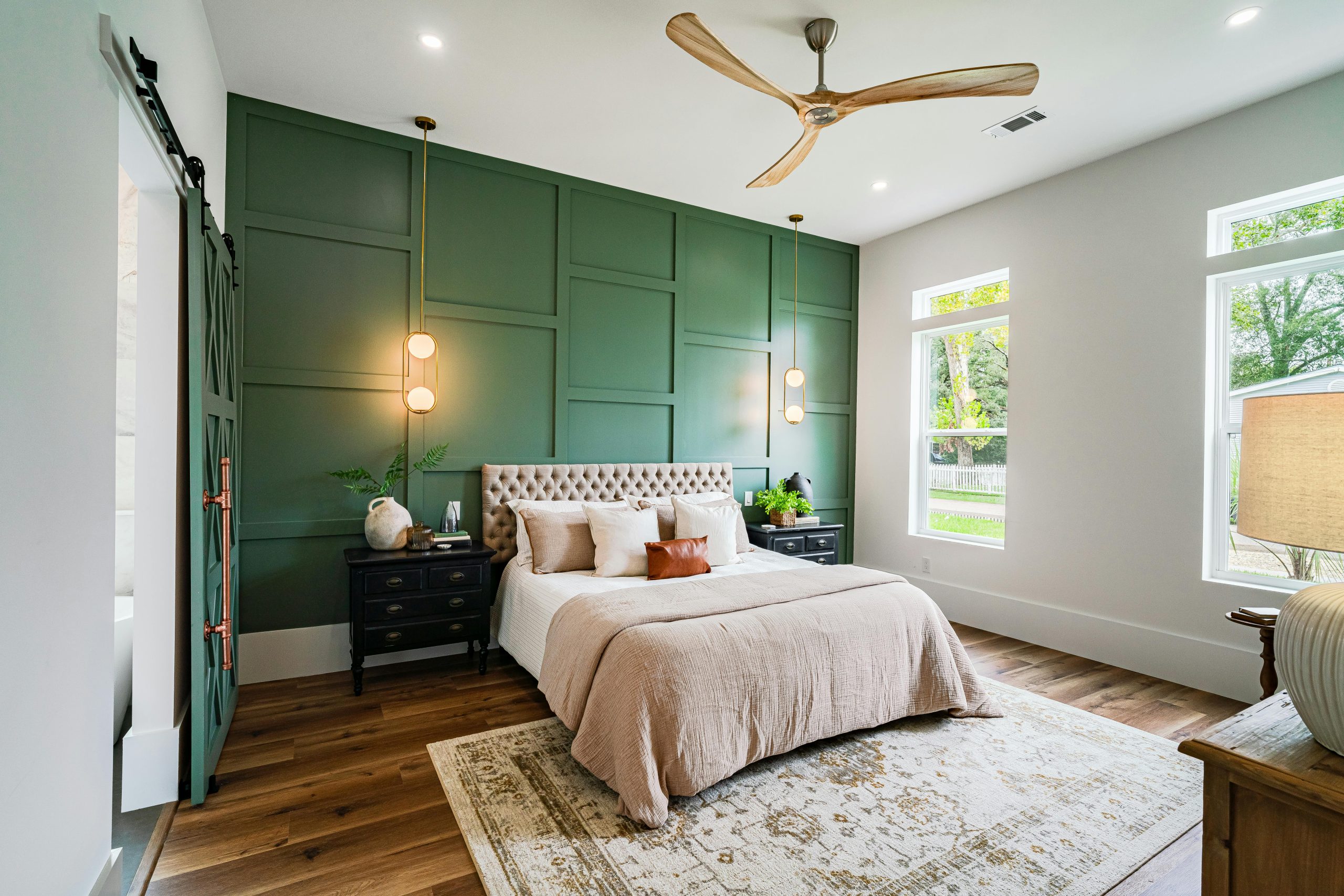 Emerald Accent Wall with Tufted Headboard and Gold Accents