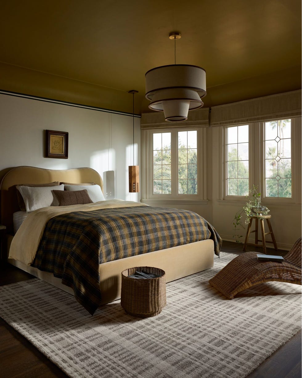 Cozy Bedroom with Plaid Bedding and Olive-Gold Ceiling
