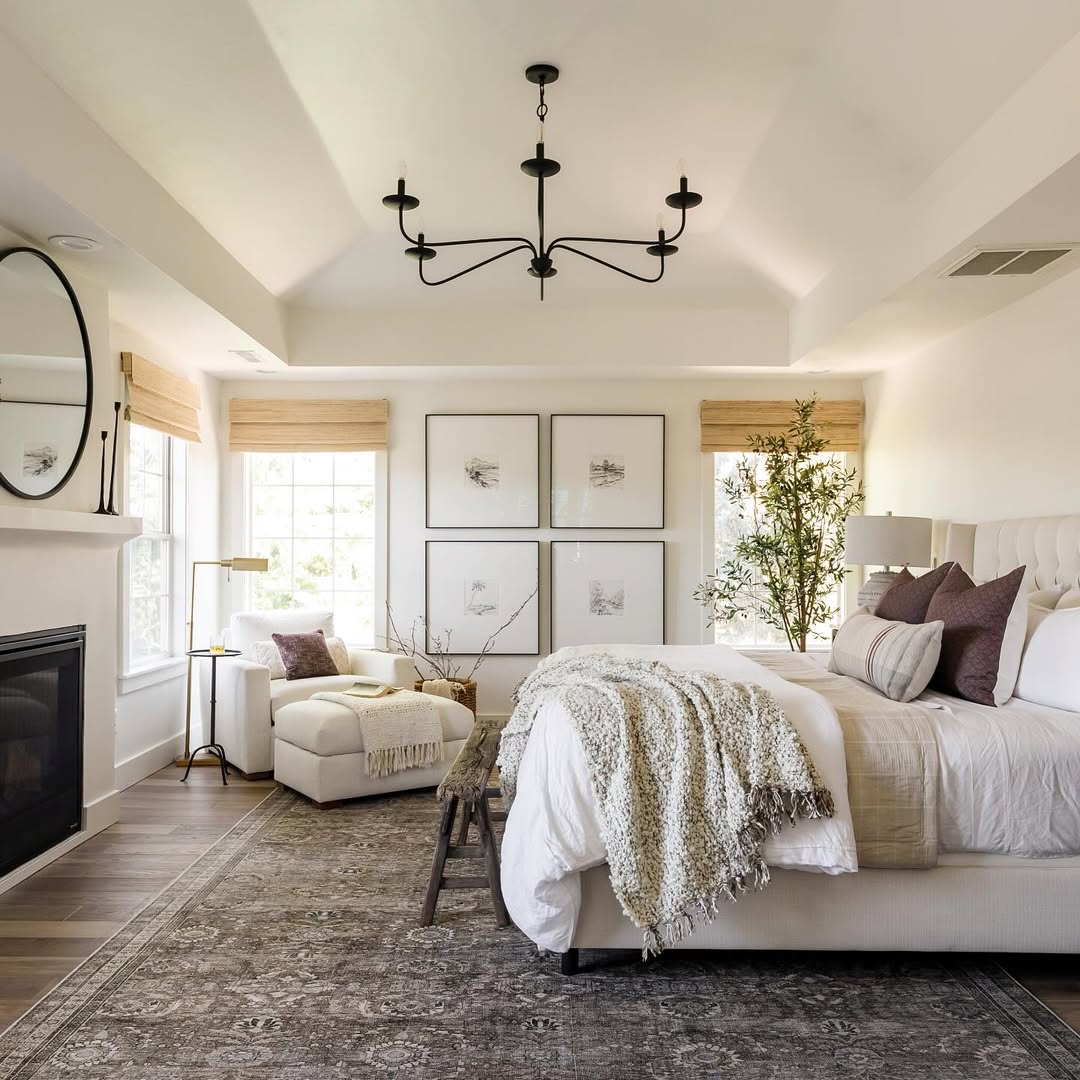 4. Serene Neutral Bedroom with Fireplace & Chandelier
