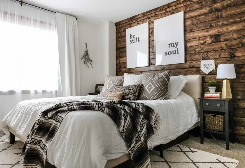 14. Cozy Plank Wood Wall with Patterned Textiles