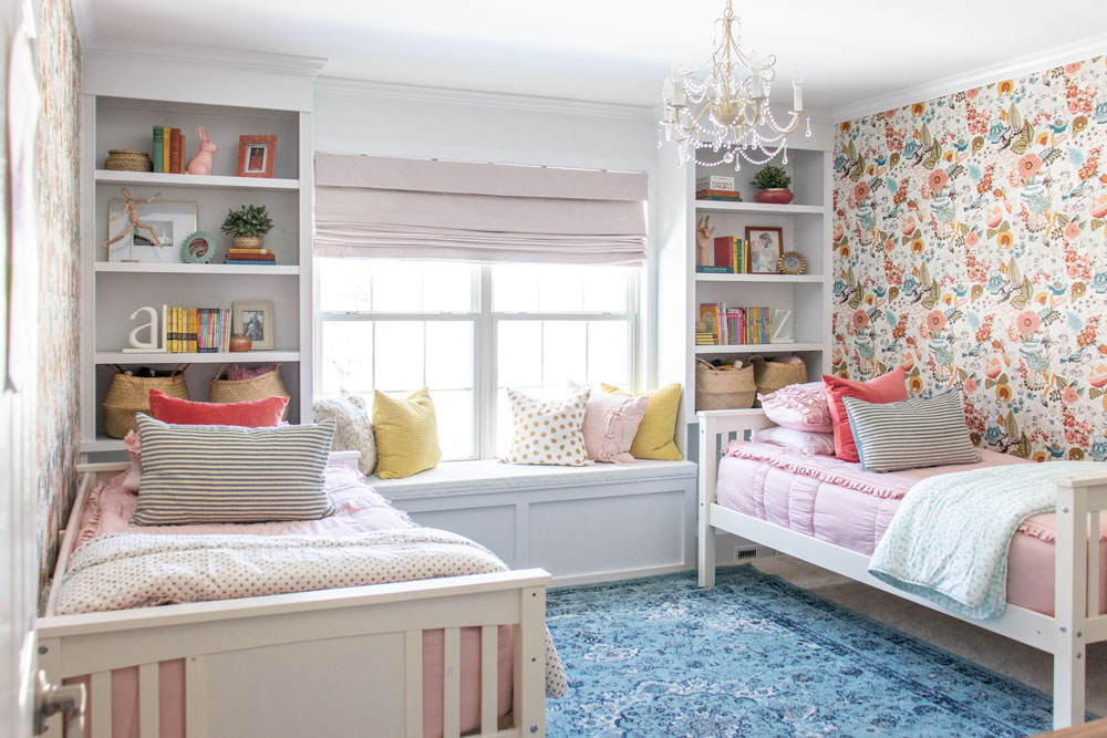 Symmetrical Girls' Room with Window Seat and Floral Charm