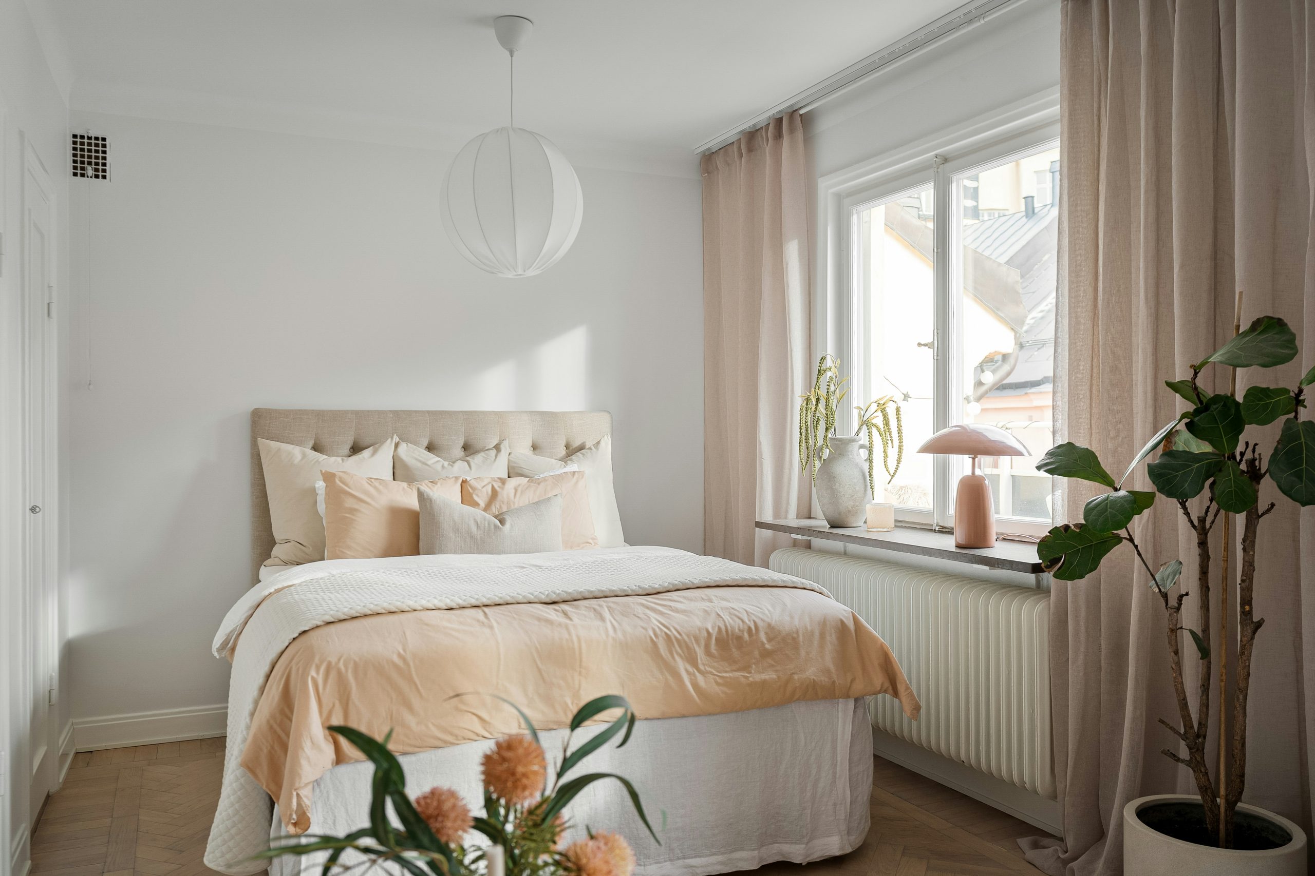Soft White and Peach Bedroom with Natural Light